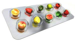 illustratie van fruit en groentesoorten in capsules 